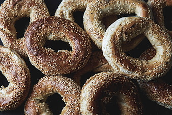 Close-up of Fresh Sesame Bagels on Dark Background
