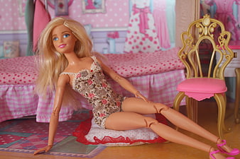 Blonde Barbie Doll Wearing Floral Lingerie in Pink Bedroom Setting