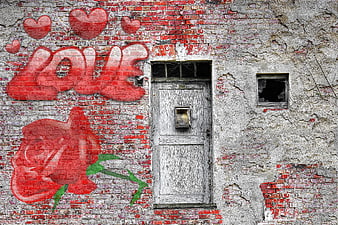Red Love Graffiti And Rose On Weathered Brick Wall With Door