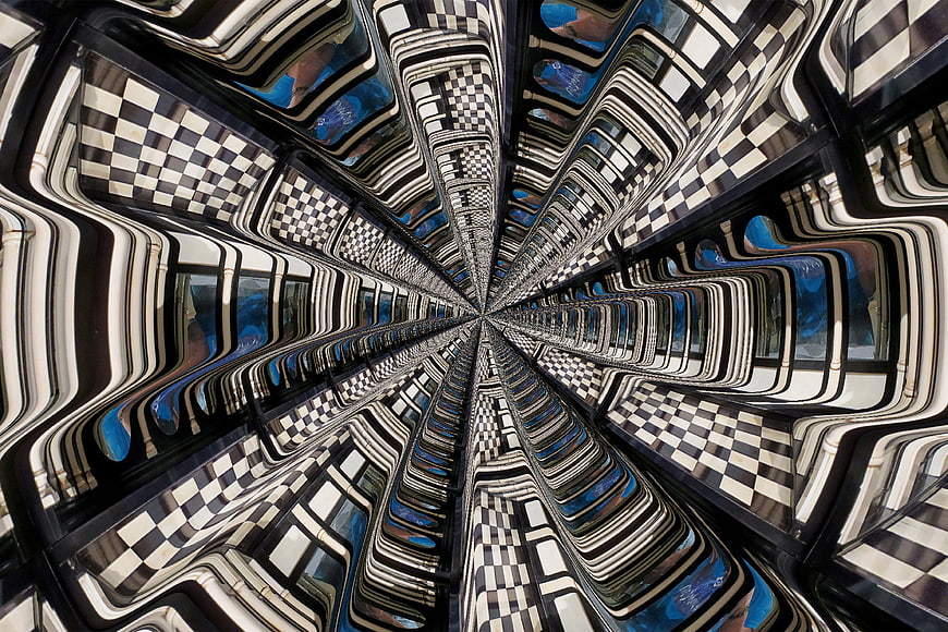 Abstract Kaleidoscope Pattern with Checkerboard and Blue Reflections