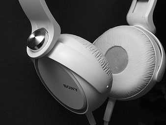 Close-up of White Sony Headphones on Black Background