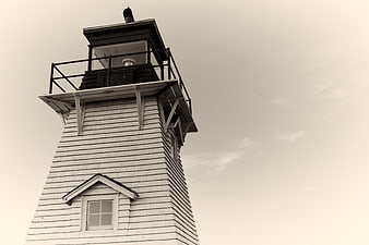 Low angle view of vintage lighthouse tower against sky