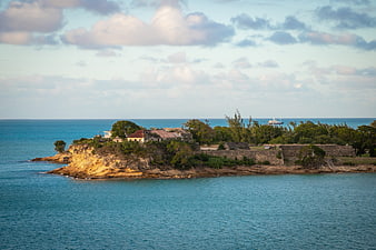 Coastal landscape with historic fort ruins and turquoise ocean