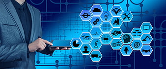 Businessman Touching Tablet With IoT Hexagonal Icons On Blue Background