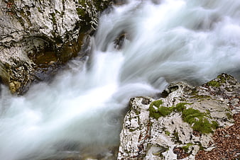 Long Exposure Flowing Water Over Mossy Rocks