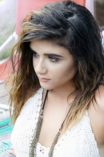 Portrait of Young Woman with Wavy Hair Looking Down