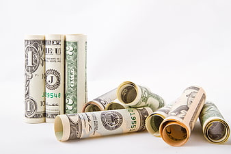 Rolled US Dollar Bills on White Background