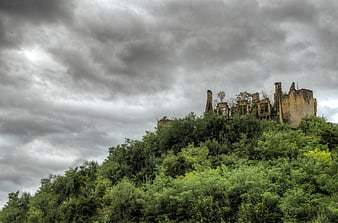 Dramatic Ruins of an Old Castle on a Green Hill