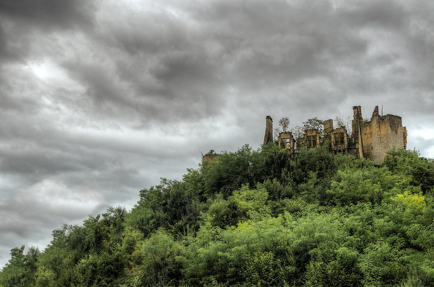Dramatic Ruins of an Old Castle on a Green Hill