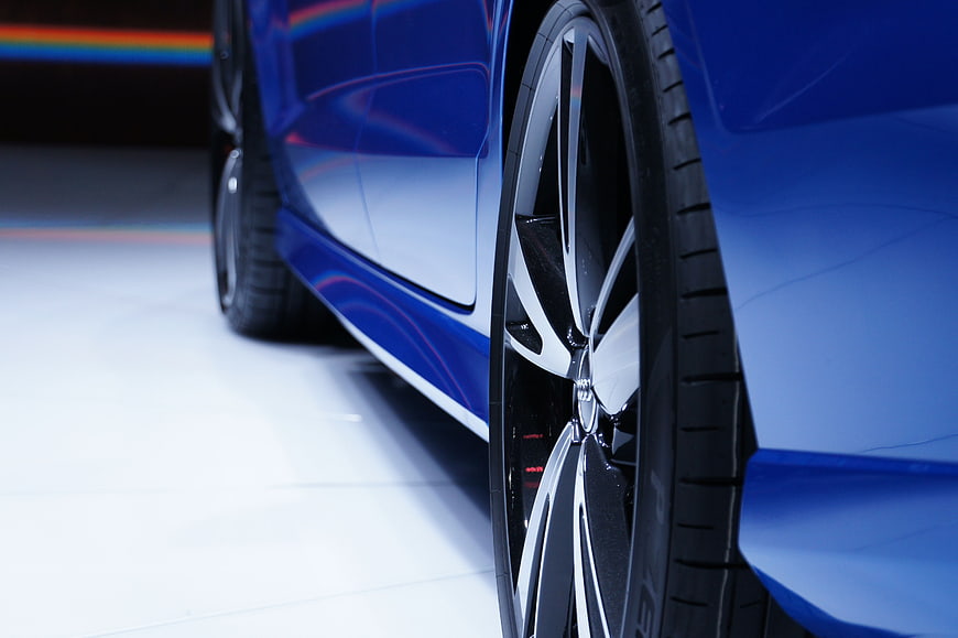 Close-up of Blue Car Wheel and Side Panel