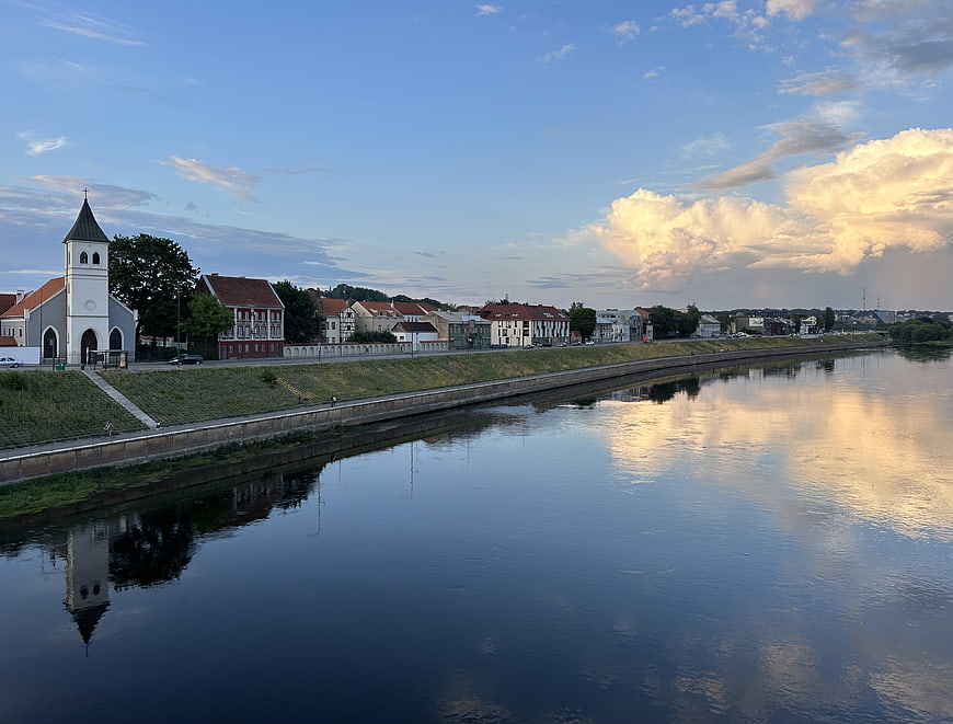 Scenic River Cityscape with Church and Cloud Reflections