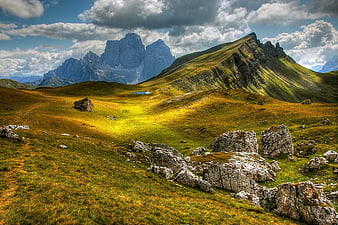 Dramatic Dolomites Mountain Landscape with Golden Grass
