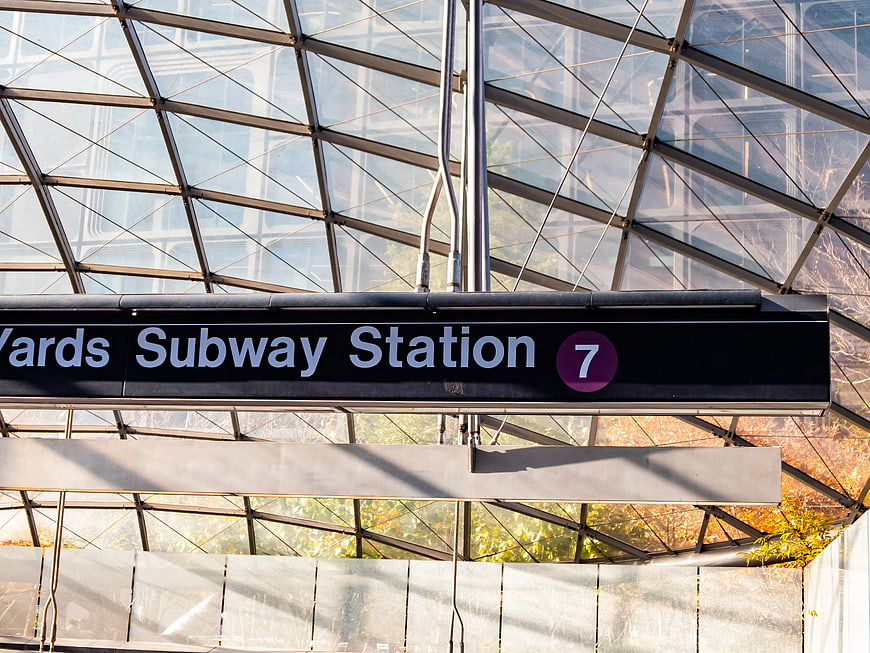 Modern Subway Station Sign Under Glass Canopy