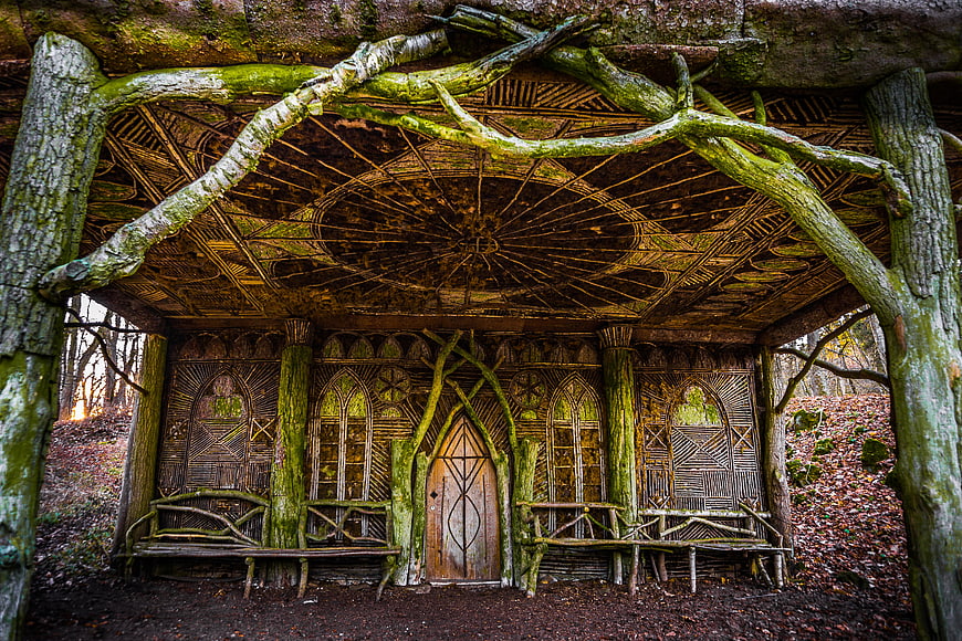 Enchanted wooden fairy hut in a mossy forest