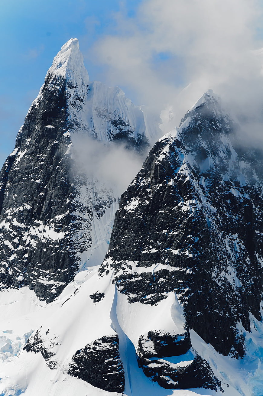 Majestic Snow-Capped Mountain Peaks with Clouds