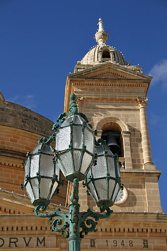 Vintage Green Street Lamp in Front of Historic Church Tower