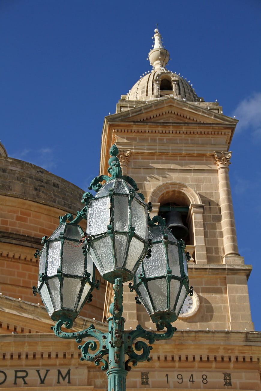 Vintage Green Street Lamp in Front of Historic Church Tower