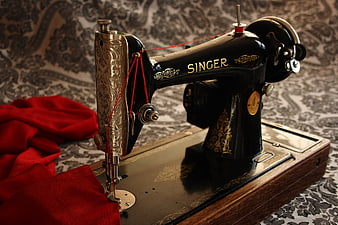 Vintage Black Singer Sewing Machine With Red Fabric