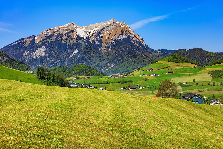 Scenic Swiss Alps Landscape with Green Meadows and Mountain Peak