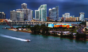 Miami skyline with seaplane landing on water
