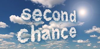 Second chance text written in clouds against blue sky