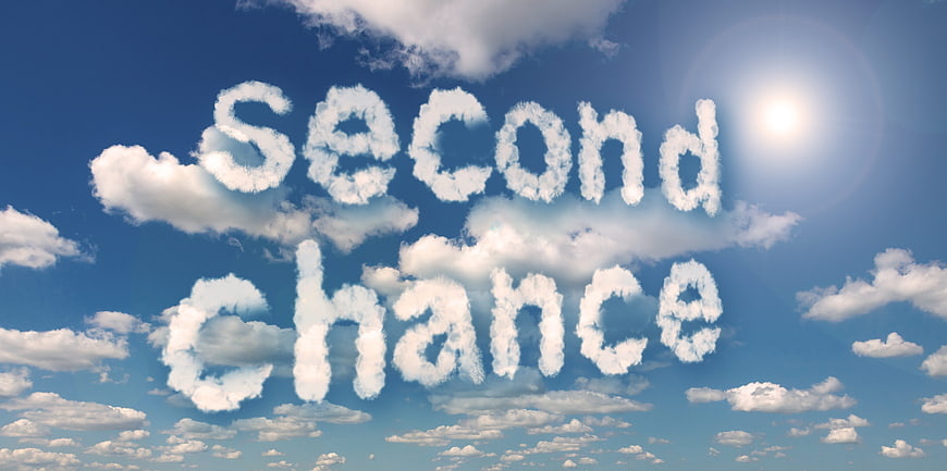 Second chance text written in clouds against blue sky