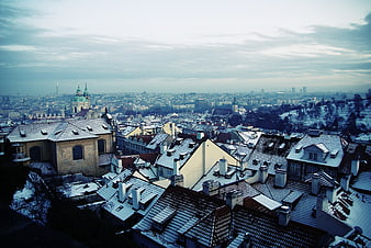 Snowy Rooftops of Prague Cityscape in Winter