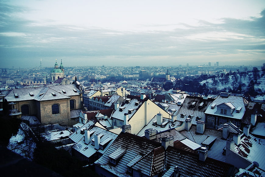Snowy Rooftops of Prague Cityscape in Winter