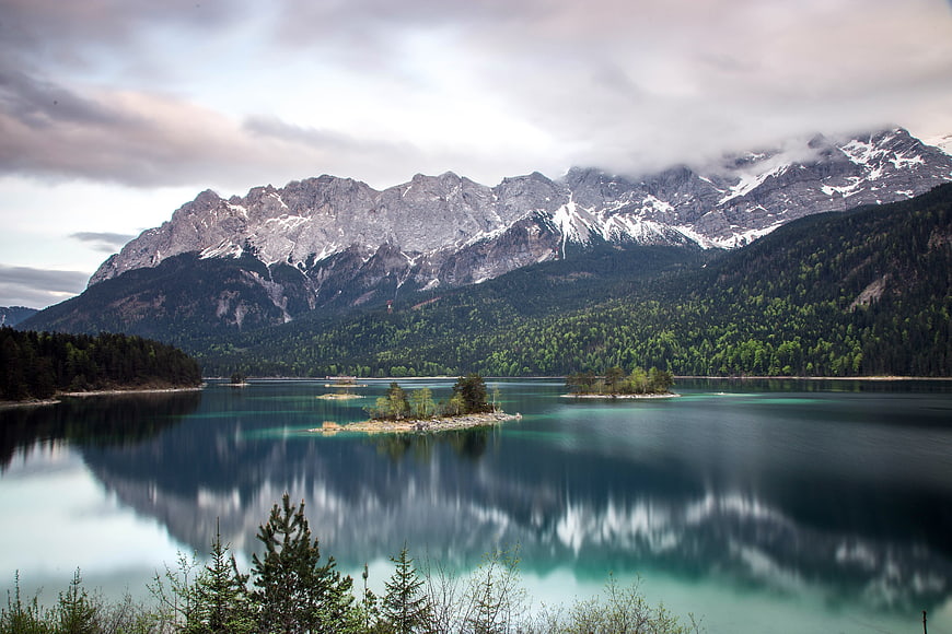 Serene Alpine Lake with Snowy Mountain Reflections