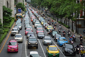 Busy Urban Traffic Jam with Cars and Motorcycles
