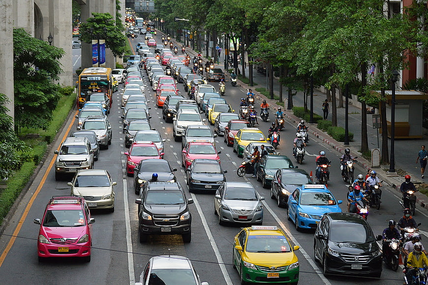 Busy Urban Traffic Jam with Cars and Motorcycles