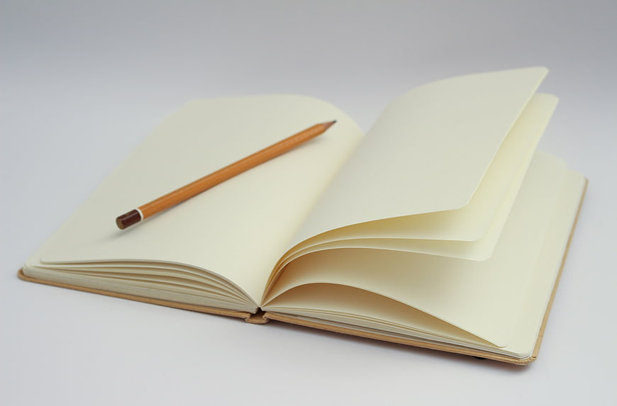 Open Blank Notebook with Pencil on White Background