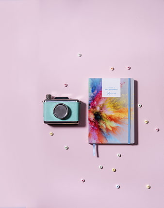 Pastel Flat Lay With Vintage Camera And Colorful Journal
