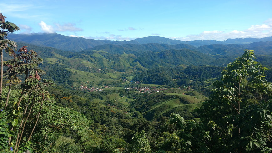Panoramic View of Lush Green Mountain Valley with Village
