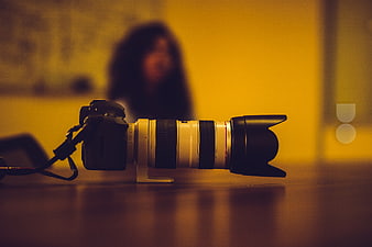 DSLR Camera with Telephoto Lens on Desk