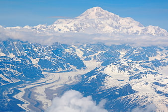 Aerial View of Snow-Capped Mountain Peak and Glacier Valley