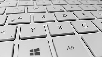 Close-up of white laptop keyboard keys