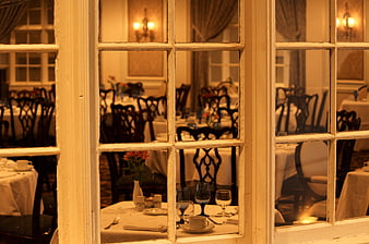 View through window into elegant restaurant dining room