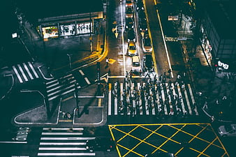Aerial Night View of Busy City Crosswalk and Traffic