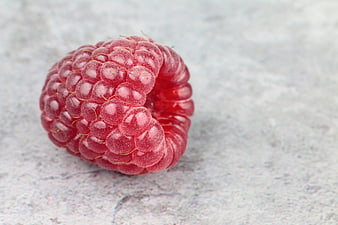 Fresh Red Raspberry Macro on Textured Background