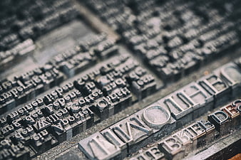 Close-up of antique metal letterpress printing blocks