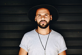 Portrait of Bearded Man in Black Hat and Grey T-Shirt