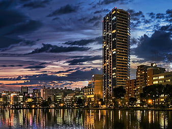 Prestige City Bangalore skyline at dusk with river reflections