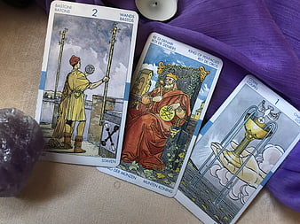 Three Tarot Cards on Purple Cloth with Amethyst Crystal