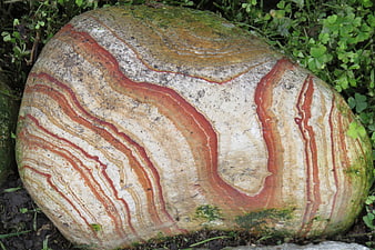 Close-up of Striped Red and White Rock in Nature