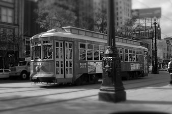Vintage black and white streetcar on city street