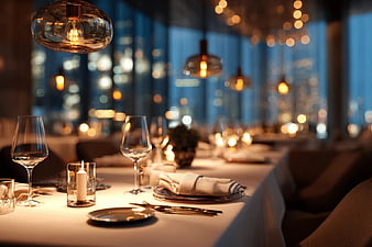 Elegant Restaurant Table Setting with City View at Night