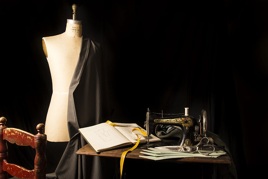 Vintage sewing workspace with mannequin and antique machine