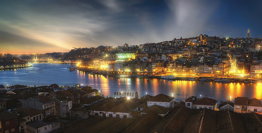 Porto Portugal Cityscape at Dusk with River Douro and Historic Buildings