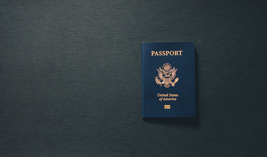 US Passport on Dark Textured Background with Copyspace